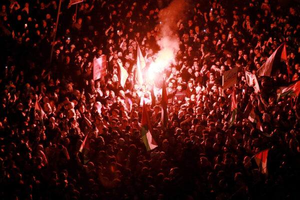 People chant slogans during a demonstration in support of Palestinians near the Embassy of Israel in Amman, Jordan, on March 28, 2024. © Khalil Mazraawi/AFP/Getty