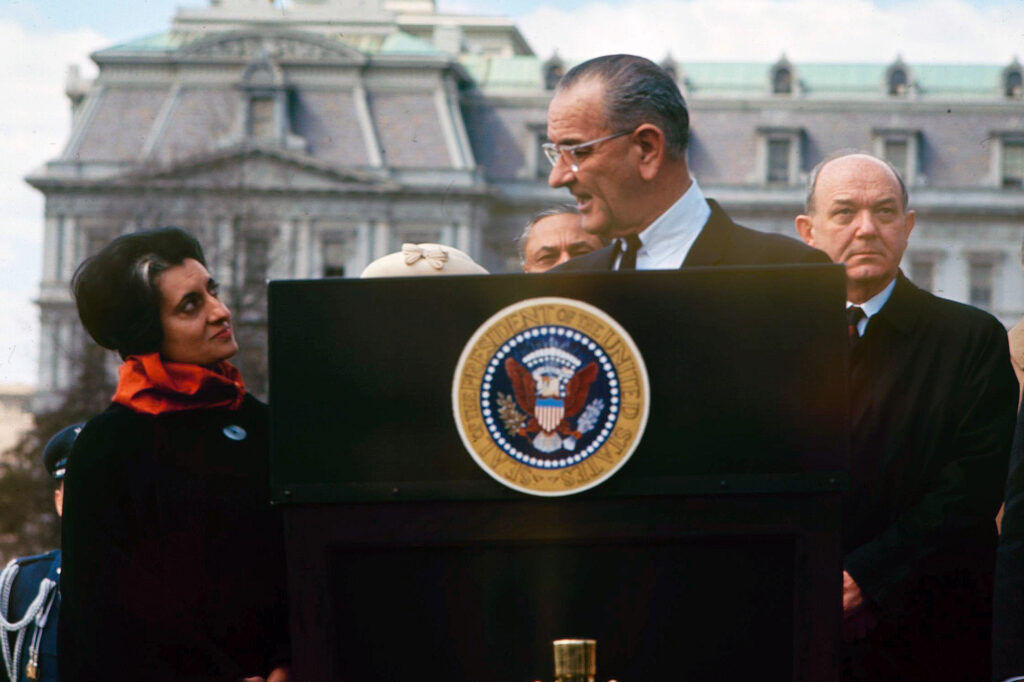 U.S. President Lyndon B. Johnson with Indian Prime Minister Indira Gandhi at a podium in Washington, D.C., in 1966. © Francis Miller/LIFE Picture Collection/Shutterstock