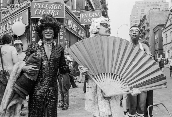 American gay liberation activist Marsha P. Johnson (left) celebrating Pride with friends at the corner of Christopher Street and 7th Avenue in New York City on June 27, 1982. © Barbara Alper/Getty