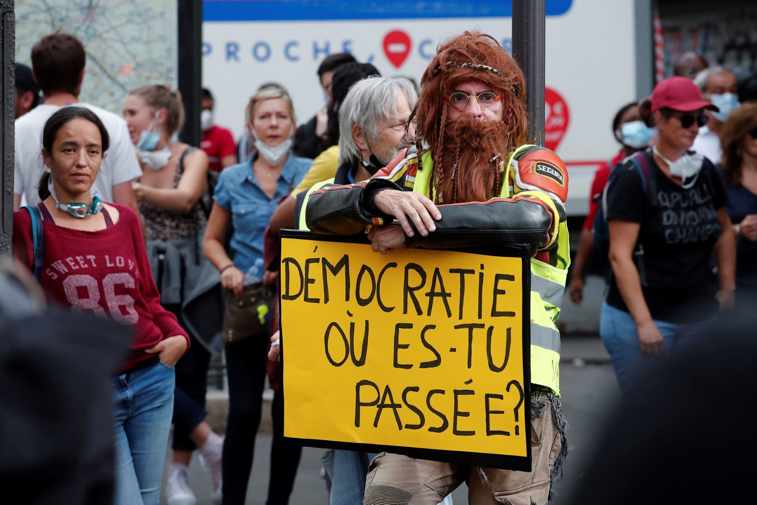 A protester holds a sign that reads: 'Democracy where have you gone?' during a demonstration against France's COVID-19 related restrictions in Paris on September 11, 2021. © Benoit Tessier/Reuters/Redux