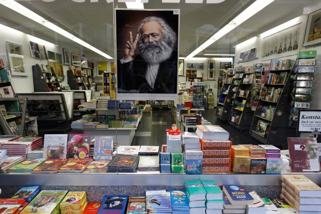 A Karl Marx poster hangs in a bookstore window in Rhineland-Palatinate, Germany. © Karl F. Schöfmann/ImageBroker/Newscom