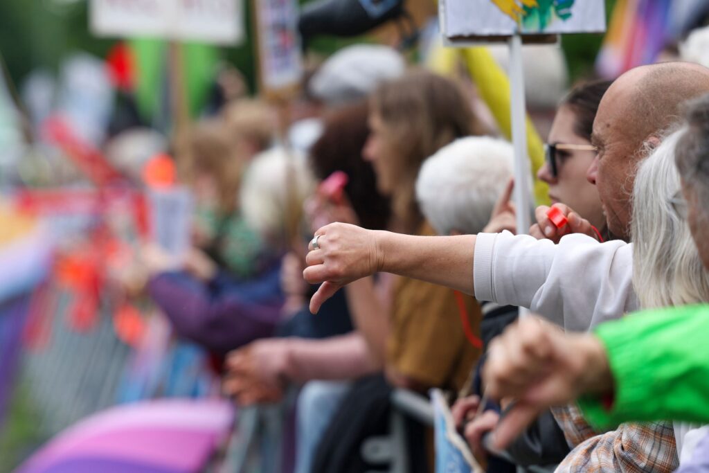 Protesters show thumbs down to the Alternative for Germany (AfD) party's in Marl, Germany, on May 25, 2024. © Chritopher Neundorf/EPA-EFE/Shutterstock